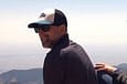 smiling man in a baseball cap